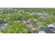 Aerial view of the property outlined, nestled among lush greenery and neighborhood homes at 638 Clayton St, Orlando, FL 32804