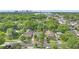 Aerial view showcasing property location amongst mature trees with the cityscape visible in the distance at 638 Clayton St, Orlando, FL 32804