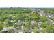 Charming neighborhood aerial showcases tree-lined streets and a vibrant cityscape in the distance at 638 Clayton St, Orlando, FL 32804