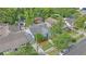 Aerial view of home showcasing mature trees, roof, and proximity to street at 638 Clayton St, Orlando, FL 32804