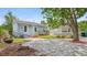 Quaint backyard showcasing a patio area, garden beds, and mature landscaping at 638 Clayton St, Orlando, FL 32804