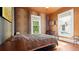 Bedroom featuring wood floors, natural light, and vibrant leopard print walls at 638 Clayton St, Orlando, FL 32804