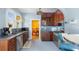 Bright eat-in kitchen features wood cabinets, stainless appliances, and tile backsplash at 638 Clayton St, Orlando, FL 32804