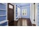 Sunroom with blue walls, custom built-ins, hardwood floors and lots of natural light at 638 Clayton St, Orlando, FL 32804