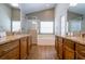 Bathroom features dual sinks, a tub and shower combo, and neutral colored walls at 8102 Pomo Dr, Kissimmee, FL 34747