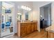 Bathroom features wood cabinets, granite countertops, and an attached open seating area at 8102 Pomo Dr, Kissimmee, FL 34747