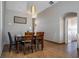 Chic dining room features a contemporary light fixture and a dining table that seats four at 8102 Pomo Dr, Kissimmee, FL 34747