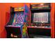 A vivid Ms. Pac-Personal and Mortal Kombat II arcade game stands ready for action in the game room at 8102 Pomo Dr, Kissimmee, FL 34747
