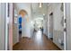 Open hallway featuring stylish flooring, arched doorways, and a glimpse into the home's layout at 8102 Pomo Dr, Kissimmee, FL 34747