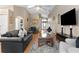 Inviting living room has high ceilings and comfortable seating, flowing into the dining area at 8102 Pomo Dr, Kissimmee, FL 34747