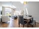 Bright living space features high ceilings, wood floors, a dining area, and access to the pool at 8102 Pomo Dr, Kissimmee, FL 34747