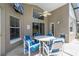 Covered patio area with furniture, fan, and view of the backyard at 8102 Pomo Dr, Kissimmee, FL 34747