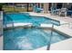 Sparkling pool and jacuzzi in a screened-in patio at 8102 Pomo Dr, Kissimmee, FL 34747