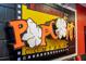 Close-up of a popcorn-themed sign adding a whimsical touch to the home theater's decor at 8102 Pomo Dr, Kissimmee, FL 34747
