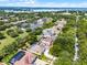Community aerial view featuring nearby amenities, lake views, solar panels, pools and neighborhood streets at 8122 Westminster Abbey Blvd, Orlando, FL 32835