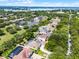 Community aerial view featuring nearby amenities, lake views, solar panels, pools and neighborhood streets at 8122 Westminster Abbey Blvd, Orlando, FL 32835