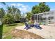 Backyard patio featuring a fire pit with Adirondack chairs, perfect for outdoor gatherings and relaxation at 8122 Westminster Abbey Blvd, Orlando, FL 32835