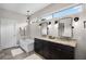 Contemporary bathroom with double vanity, elegant lighting, and separate soaking tub at 8122 Westminster Abbey Blvd, Orlando, FL 32835