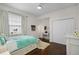 Inviting bedroom features a window with a view, a desk, and a closet at 8122 Westminster Abbey Blvd, Orlando, FL 32835