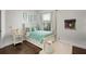 Charming bedroom featuring hardwood floors, a window, and a comfortable bed at 8122 Westminster Abbey Blvd, Orlando, FL 32835