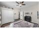 Neutral bedroom with hardwood floors, a ceiling fan, a closet, and dresser at 8122 Westminster Abbey Blvd, Orlando, FL 32835