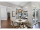 Cozy breakfast nook features a round table, wood chairs, and a view of the outdoor patio at 8122 Westminster Abbey Blvd, Orlando, FL 32835