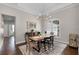 Dining area with decorative chandelier, wood table, and large window at 8122 Westminster Abbey Blvd, Orlando, FL 32835