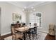 Dining area with wood table and chairs, and large window at 8122 Westminster Abbey Blvd, Orlando, FL 32835