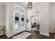 Front foyer with decorative double doors and an adjacent home office at 8122 Westminster Abbey Blvd, Orlando, FL 32835