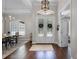 Light-filled front foyer with decorative double doors at 8122 Westminster Abbey Blvd, Orlando, FL 32835
