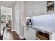 Bright kitchen with marble countertops and white cabinets at 8122 Westminster Abbey Blvd, Orlando, FL 32835