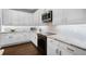 White kitchen with modern appliances, granite countertops, and subway tile backsplash at 8122 Westminster Abbey Blvd, Orlando, FL 32835