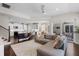 Spacious living area with views to the kitchen, breakfast nook, and outdoor patio at 8122 Westminster Abbey Blvd, Orlando, FL 32835
