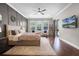 Beautiful main bedroom with natural light, stylish decor, and access to outdoor lanai at 8122 Westminster Abbey Blvd, Orlando, FL 32835
