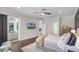 Spacious main bedroom with hardwood floors, a ceiling fan and a sliding door to the lanai at 8122 Westminster Abbey Blvd, Orlando, FL 32835