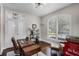 Comfortable office space featuring hardwood floors, a large window and a wooden desk at 8122 Westminster Abbey Blvd, Orlando, FL 32835