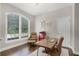 Inviting home office featuring hardwood floors, a large window and a comfortable chair at 8122 Westminster Abbey Blvd, Orlando, FL 32835