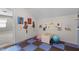 This playroom is equipped with ample storage, colorful decor, and a fun, safe floor at 8122 Westminster Abbey Blvd, Orlando, FL 32835