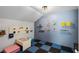 This playroom is equipped with ample storage, colorful decor, and a fun, safe floor at 8122 Westminster Abbey Blvd, Orlando, FL 32835