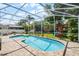 Screened swimming pool and backyard with patio and play area at 8122 Westminster Abbey Blvd, Orlando, FL 32835