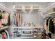 Organized walk-in closet with shelves, rods, and ample storage for clothing and accessories at 8122 Westminster Abbey Blvd, Orlando, FL 32835