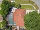 An aerial shot shows the property's layout with the roof, pool, backyard, and surrounding trees at 8346 Mattituck Cir, Orlando, FL 32829