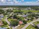 Expansive aerial view showcasing a residential area with lush greenery at 8346 Mattituck Cir, Orlando, FL 32829