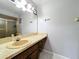 Bathroom with vanity, large mirror, countertop space, and shower with sliding doors at 8346 Mattituck Cir, Orlando, FL 32829