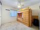 Bedroom featuring carpeted floors, ceiling fan, and unique lofted bed with storage at 8346 Mattituck Cir, Orlando, FL 32829