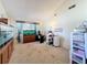 Spacious bonus room featuring carpeted flooring, lots of natural light, and a functional layout at 8346 Mattituck Cir, Orlando, FL 32829