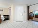 Bright entryway boasts tiled floors and a storm door for added security and natural light at 8346 Mattituck Cir, Orlando, FL 32829