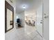 Inviting entryway with tiled floors, and views of the dining and living room at 8346 Mattituck Cir, Orlando, FL 32829