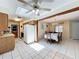 Open kitchen and dining area with tiled floors, and ample counter space at 8346 Mattituck Cir, Orlando, FL 32829