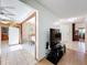 Open-concept living space with tile flooring, view of the kitchen, and a seamless transition to the entry hall at 8346 Mattituck Cir, Orlando, FL 32829